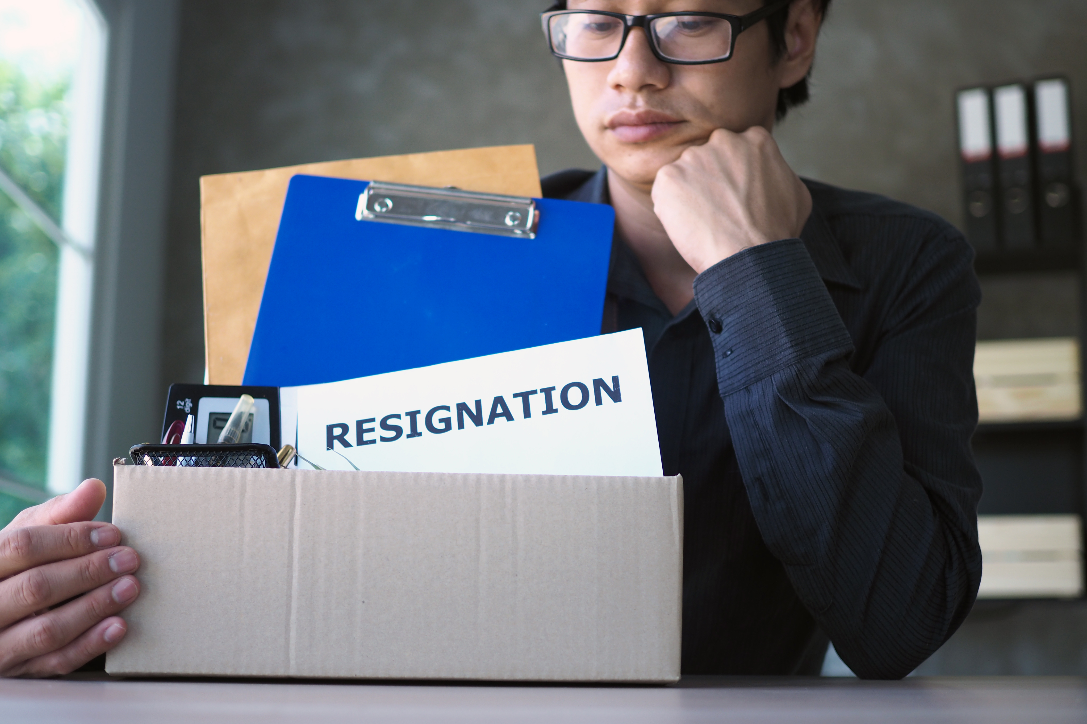 A man feeling frustrated with resignation letter