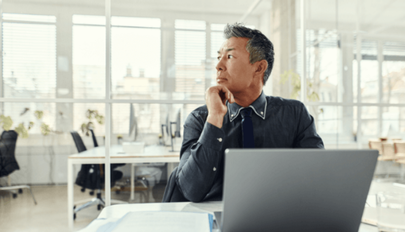 Male professional working on his laptop in a coworking space